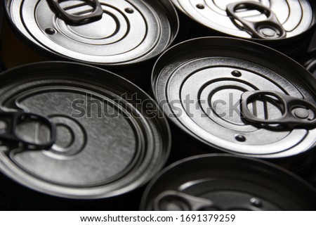 Closeup of easy open ring-pull tab steel cans-top of tin can minimalistic composition as background Royalty-Free Stock Photo #1691379259