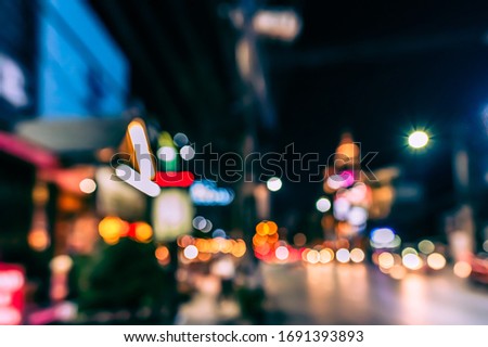 Vintage tone Abstract Blurred Road in night time with light bokeh for background usage.