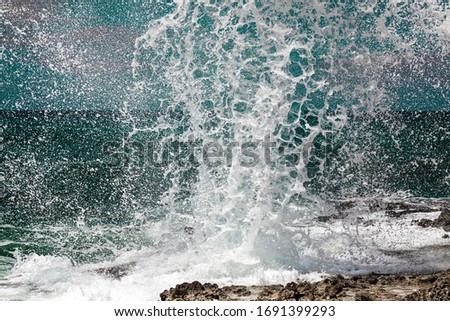 Spray from the famous Blow Holes on the south coast of Grand Cayman
