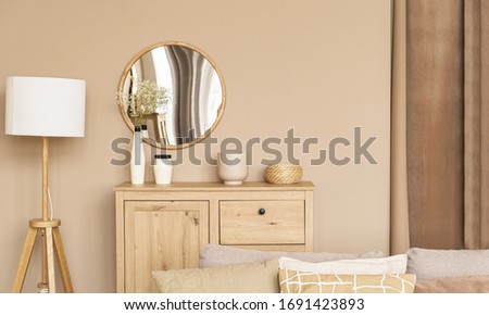 Cozy beige home wooden interior in warm colors. Minimalistic Scandinavian interior. Beautiful bright room. Royalty-Free Stock Photo #1691423893