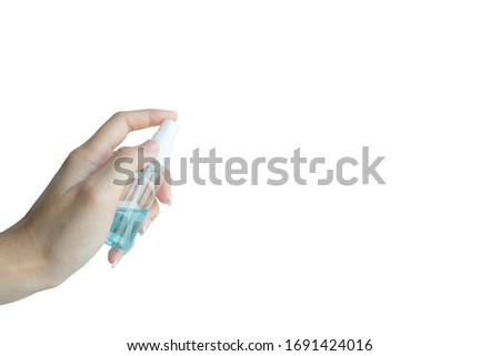 A female hand spraying an antibacterial sanitizer spray used for killing disease, bacteria, virus and Coronavirus or Covid-19 with copy space on white background. Dispenser infection control concept. Royalty-Free Stock Photo #1691424016