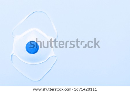 Mask on blue background. Coronavirus or Covid-19 virus concept. Blue filter
