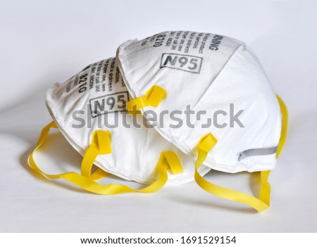 As the COVID-19 coronavirus pandemic broadens in scope, more people are wearing N95 respirator face masks making them hard to find for health care professionals Royalty-Free Stock Photo #1691529154