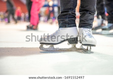 Detail of ice skating while skating on ice rink