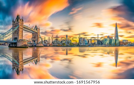 Tower Bridge sunset panorama reflected in river Thames. London