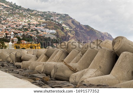 Offshore wave protection structures, stationary breakwaters, on the promenade of Funchal, Madeira Royalty-Free Stock Photo #1691577352
