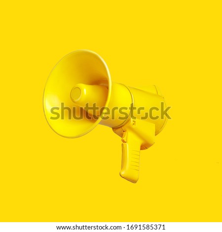 Yellow megaphone loudspeaker on a yellow background
