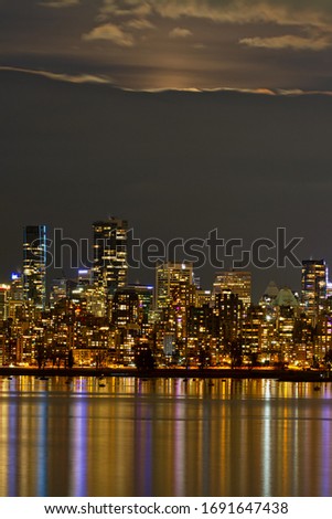 downtown Vancouver before cloudy moonrise, British Columbia, Canada