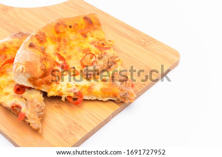 Pizza slice on over white background. Selective focus.