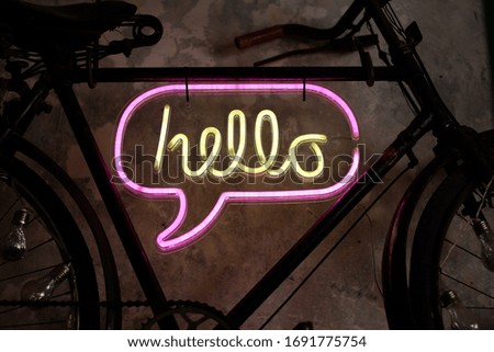 A Hello sign hanging on the wall