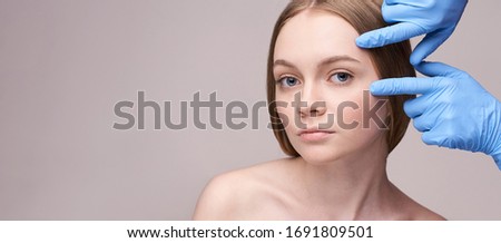 Young pretty woman studio portrait. Cosmetology concept. Esthetic woman face. Skin care dermatology beauty contour. Harmony girl. For cream, lotion horizontal banner. Copyspace Royalty-Free Stock Photo #1691809501