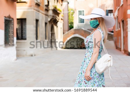 travel woman wearing face mask for protection