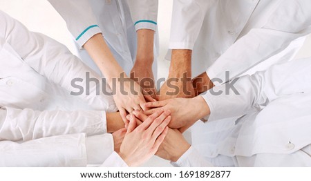 Teamwork. Conceptual photos of hands of medical personal on top of each other. 