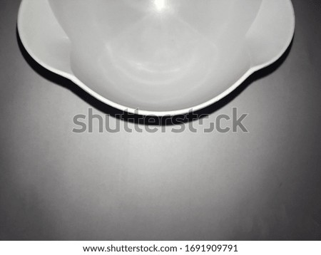 An abstract picture of a white bowl