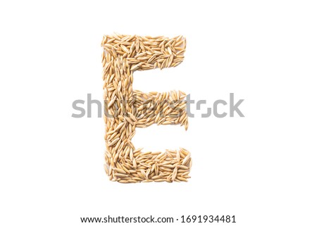 Alphabet on a white background. The letters are made of oat seeds.