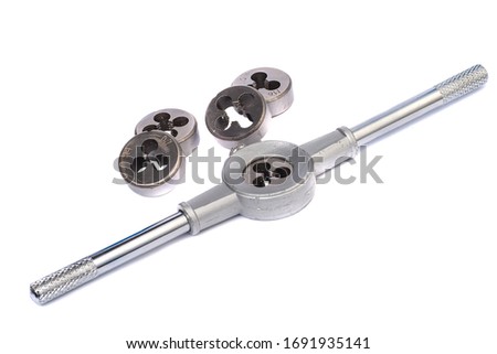 Hand tool for cutting threads with interchangeable dies isolated on a white background