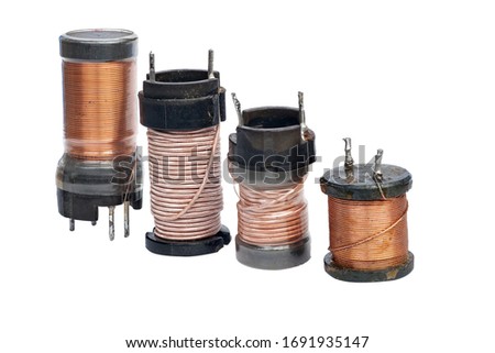 four inductors with a ferrite core isolated on a white background Royalty-Free Stock Photo #1691935147