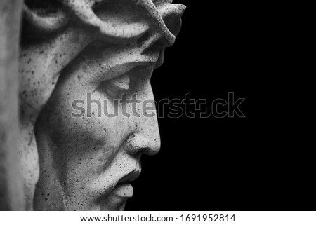 Close up Jesus Christ crown of thorns. Fragment of an ancient stone statue.