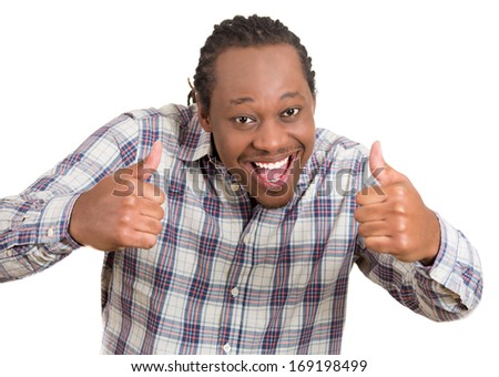 Closeup portrait of handsome young smiling man in plaid shirt giving two thumbs up at camera sign isolated on white background. Positive human emotions facial expression feelings. Symbols