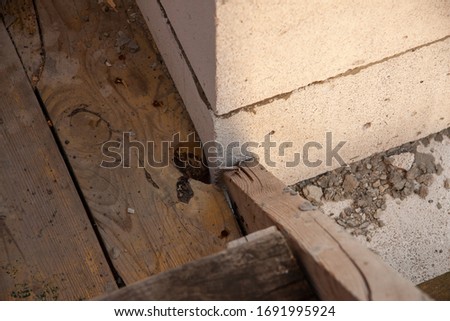 The joint of the floor and the walls on the construction site of the house.
