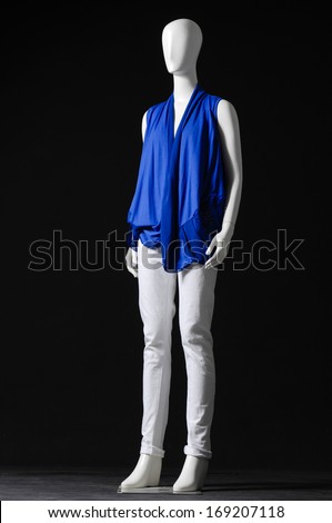 full-length female Mannequin dressed in black with blue shirt and trousers 