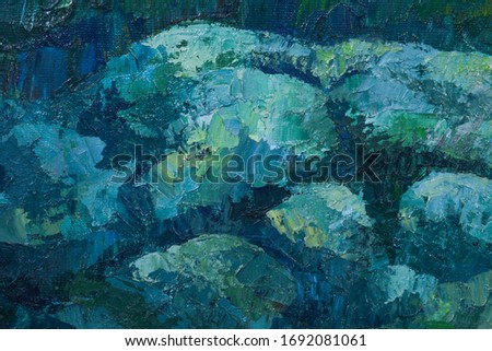 Fragment of pictorial artwork close up. On the canvas, large strokes of deep blue, green, turquoise and gray paint are applied. Textured painting with a palette knife. Modern art. 