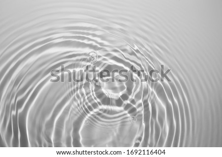 Soft focus cosmetic moisturizer water cooling mist toner or emulsion blue gray abstract background Royalty-Free Stock Photo #1692116404