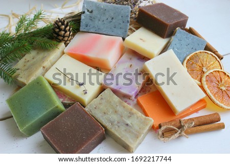 Colorful handmade soap concept. Natural handmade soap on a wooden background.Handmade natural eco soap, selective focus. Copy of the space, top view, background mode. Healthy skin. Wash their hands. Royalty-Free Stock Photo #1692217744