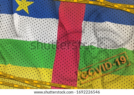 Central African Republic flag and Covid-19 biohazard symbol with quarantine orange tape and stamp. Coronavirus or 2019-nCov virus concept