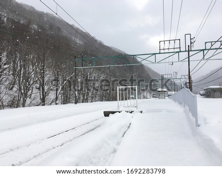 Train Station covered with Snow (Doai station, Joetsu Line, yubiso, minakami, Gunma, Kanto, Japan)  Royalty-Free Stock Photo #1692283798