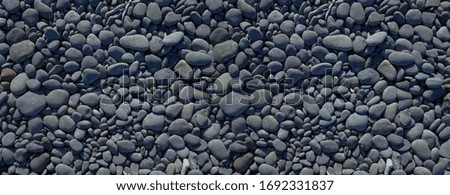 pebbles on a beach background texture. Banner wallpaper                               