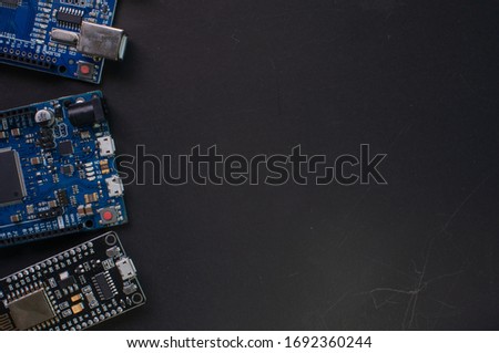 Microcontroller board on a black background