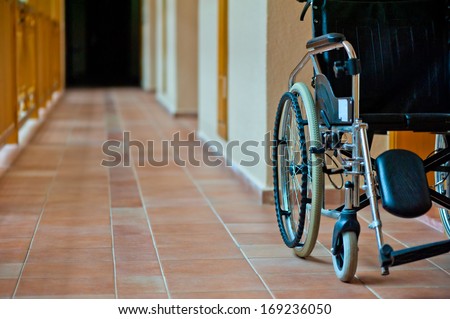 empty wheelchair in hospital corridor