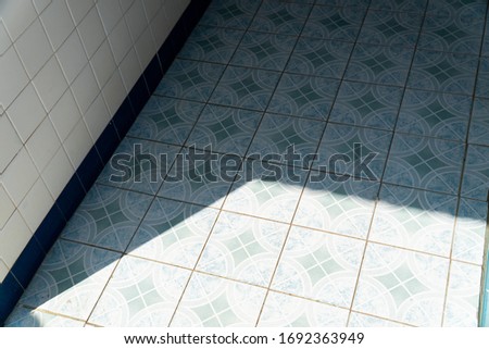 Shadows on the bathroom floor