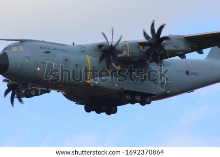 Airbus A400 Atlas RAF military transport plane flying low Royalty-Free Stock Photo #1692370864