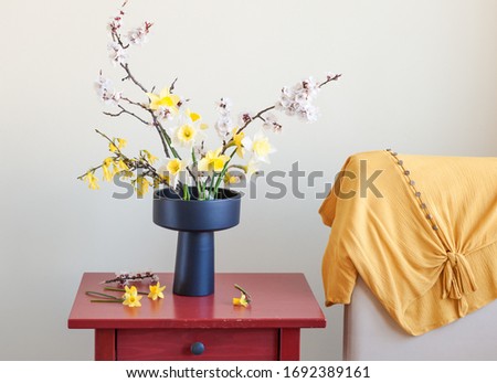 Beautiful arrangement of spring flowers in a black porcelain vase