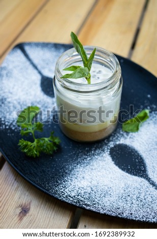 Traditional Portuguese Serradura (Saw Dust Pudding) Side Isometric View Portrait On A Wooden Background