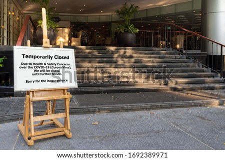 restaurant, hotel, company, shopping center closed due to coronavirus or covid-19 pandemic outbreak lockdown. coronavirus news temporarily closed board in front of building after government shutdown Royalty-Free Stock Photo #1692389971