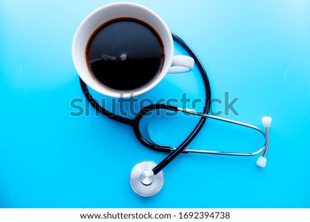 coffee cup and stethoscope, relaxing concept for doctor. On a blue background. Medical background concept