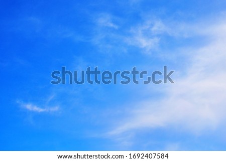 On a strong wind day, A beautiful blue sky and streaky clouds like heaven. Royalty-Free Stock Photo #1692407584