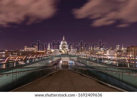 Looking across the millennium bridge, towards St Pauls Cathedral in London