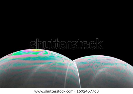 Creative bubble macro photography. Colorful vibrant color patterns. Isolated on black background.  
