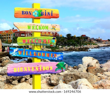 Welcome sign in different languages in the Caribbean island of Curacao. "Bon Bini" means "Welcome" in Papiamentu on the Netherlands Antilles or Leeward Islands, Aruba, Curacao and Bonaire.