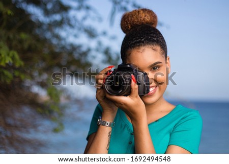 African American woman  photographer taking outdoor photos -  Black people