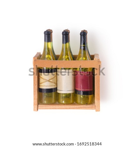 A magnetic souvenir "Box with bottles of wine" isolated on white background. Design element with clipping path