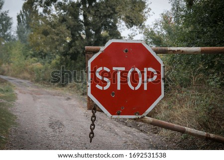 
red stop sign on a country road