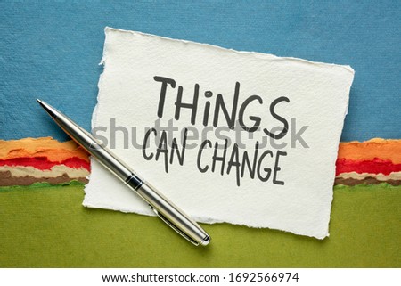 things can change -  optimistic inspirational reminder, handwriitng on a handmade paper against colorful abstract landscape Royalty-Free Stock Photo #1692566974