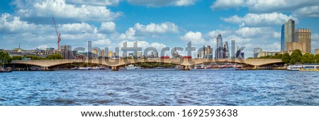 Panoramic view of the Waterloo Bridge and the river Thames on a beautiful sunny day in London