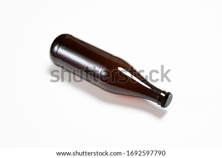 Full brown Beer Bottle Mock-up with blank label on white background.High resolution photo