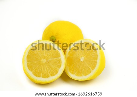 Natural Lemon fruit with cut in half isolated on white background. Clipping path.